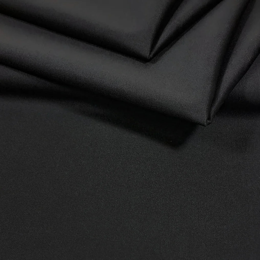 Silver Wool: the fine diagonal weave and folds of our black Merino cloth